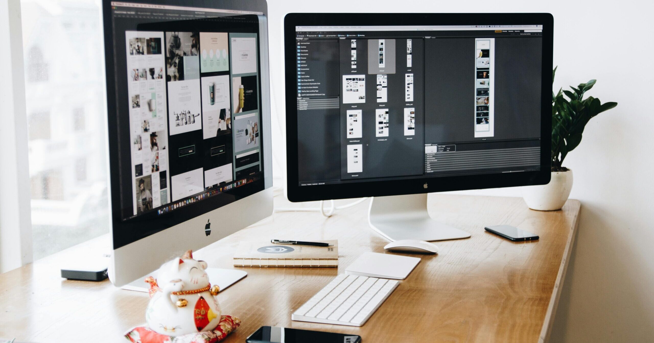 A well-organized design workspace with dual monitors and design software on display.